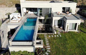 Our exclusive villa with a private pool, located in Turgutreis, Bodrum, boasts a magnificent sea view and features 6 bedrooms, 6 bathrooms, 2 living rooms, and 2 kitchens - 