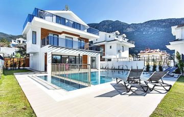 <p>Located in Fethiye's Ovacık area, our private villa with 4 bedrooms, 4 bathrooms, and a private pool offers a peaceful environment amidst nature and is just 4 km away from Turkey’s most famous beach, Ölüdeniz - 