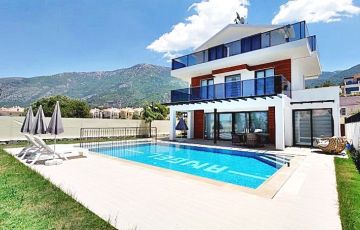 <p>Located in Fethiye's Ovacık area, our private villa with 4 bedrooms, 4 bathrooms, and a private pool offers a peaceful environment amidst nature and is just 4 km away from Turkey’s most famous beach, Ölüdeniz - 